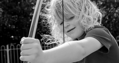 Child playing with archery bow